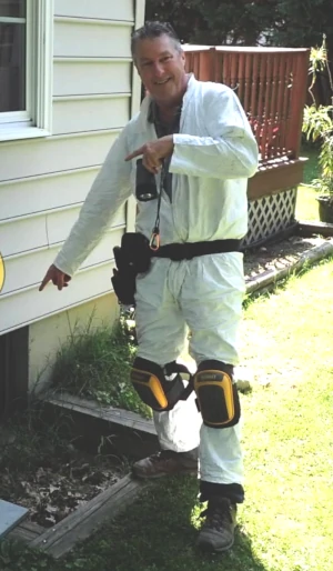 About Our Home Inspectors 4 Kelly about to enter a crawlspace while performing a home inspection by FullScale Home Inspection.